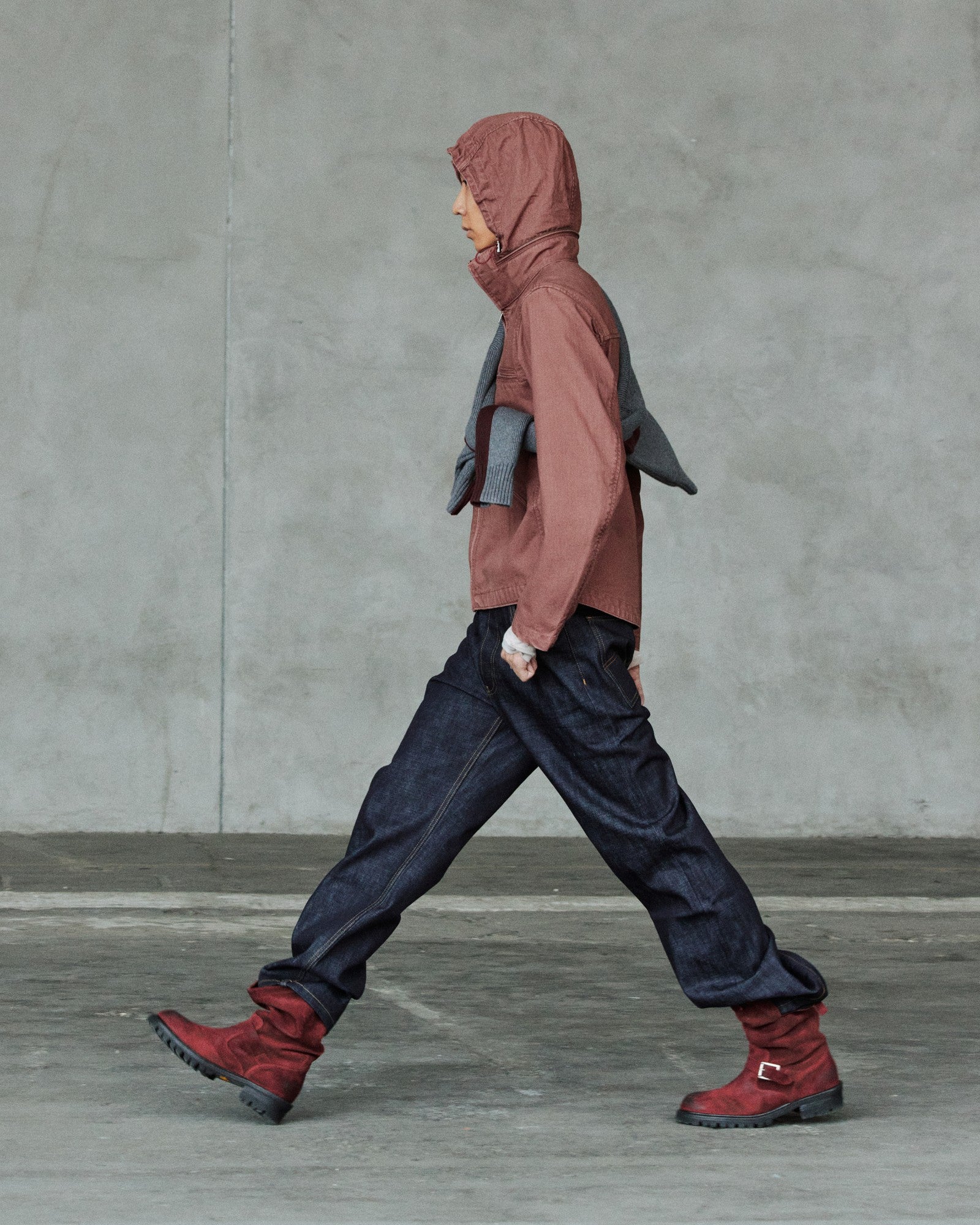 FW26 runway — hooded top with red boots